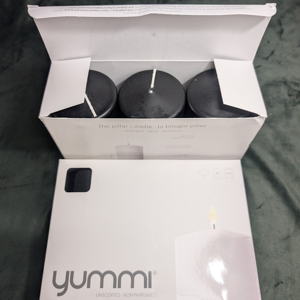 2 NWT Yummi 3x6 Black Pillar Candles 3 pack 60 hours. Clean Burning. MSRP $68